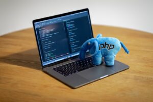 blue elephant figurine on macbook pro